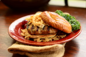 French Onion Turkey Burger on Pretzel Bun with Steak Fries